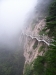 Walkway across rock face disappears into the mist, Huangshan (Yellow Mountain), Anhui province