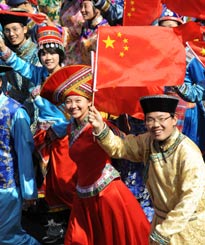 Participants take part in a parade in celebration of the 60th founding anniversary of the People's Republic of China